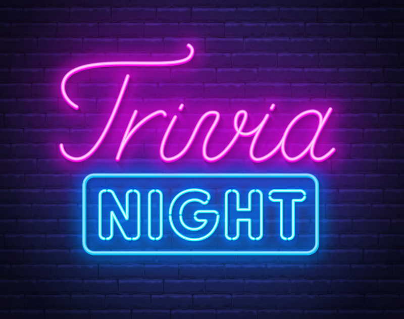 Trivia night neon sign on a brick wall .